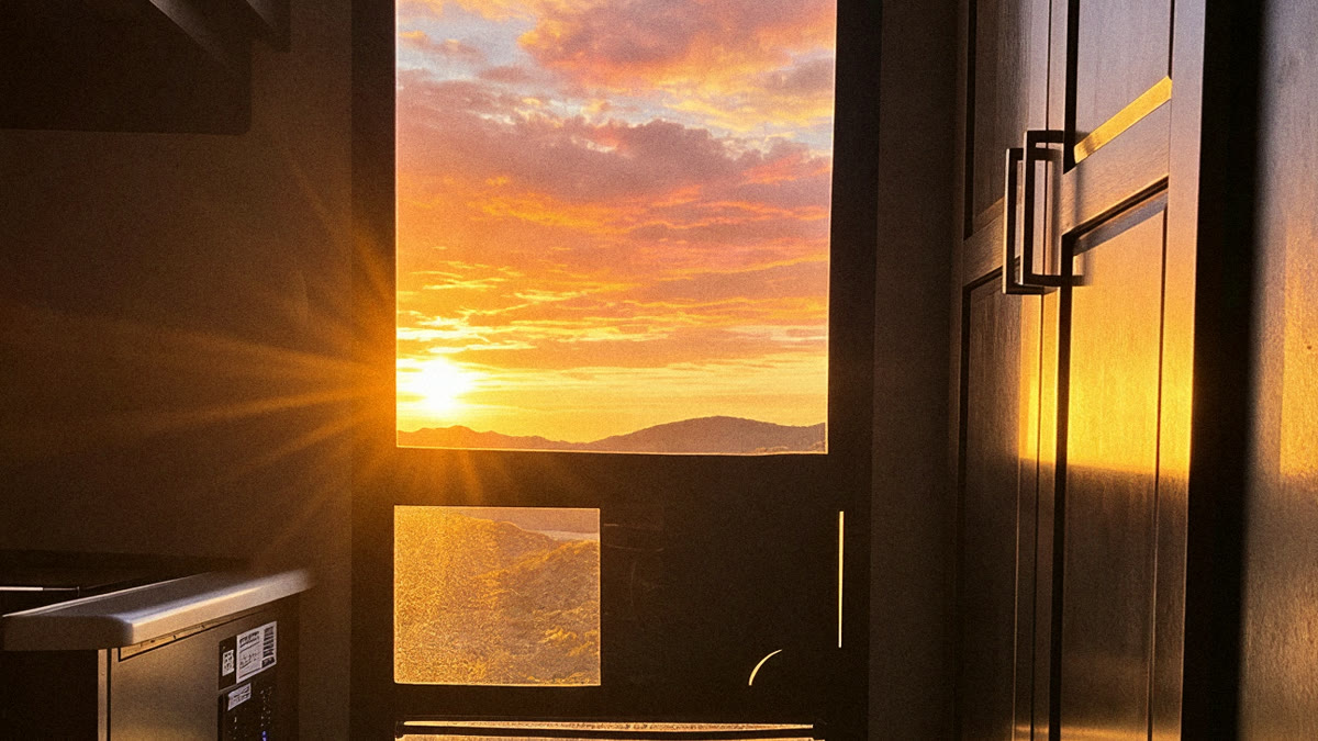 Sunset seen from inside the RV through the screen door with Clear View on it
